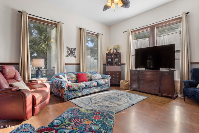 living room with light hardwood / wood-style floors and ceiling fan