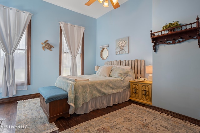 bedroom featuring ceiling fan and dark hardwood / wood-style flooring