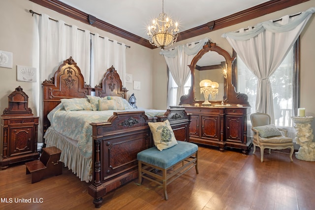 bedroom with wood-type flooring, ornamental molding, and an inviting chandelier