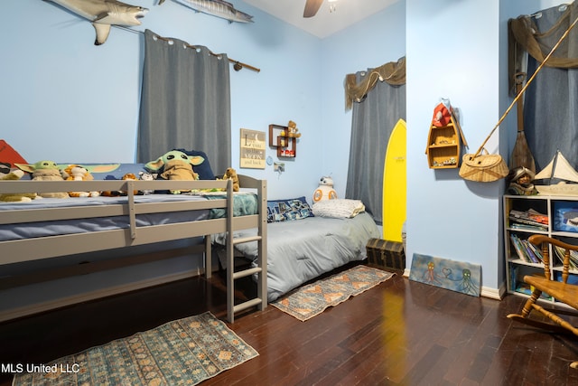 bedroom featuring dark hardwood / wood-style floors and ceiling fan