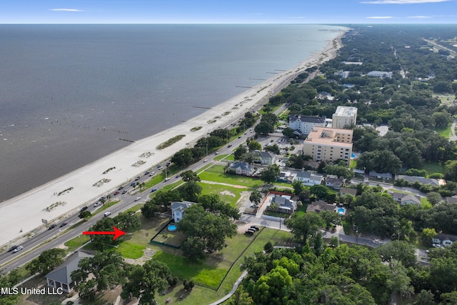 drone / aerial view featuring a water view and a beach view