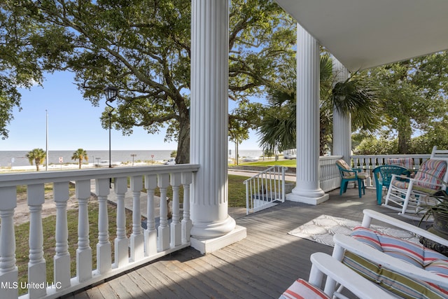 deck featuring a water view