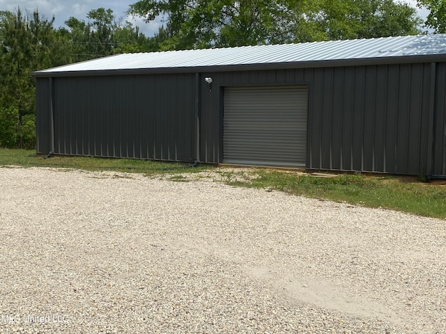 view of outbuilding with a garage