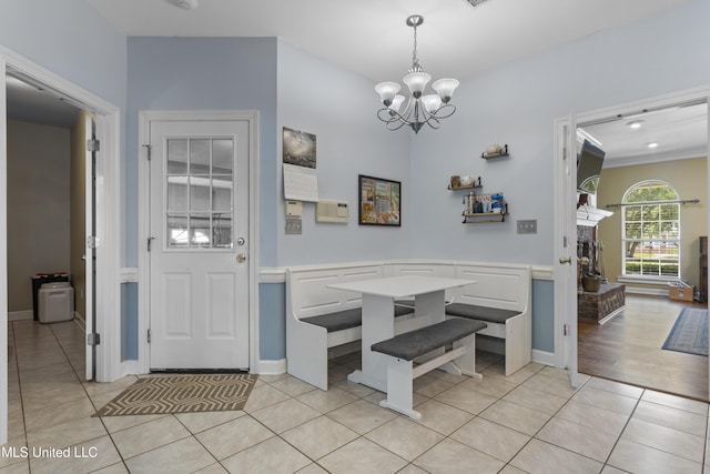 12880 Coles Cv, Gulfport, MS 39503 - foyer entrance with a chandelier, light tile patterned floors, and baseboards
