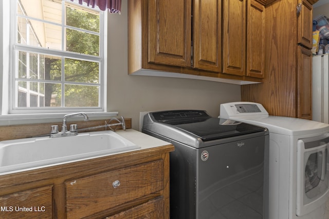 12880 Coles Cv, Gulfport, MS 39503 - laundry room with cabinet space and independent washer and dryer
