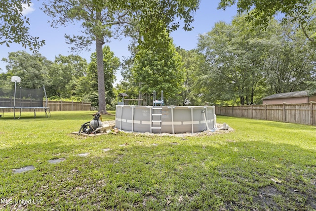 12880 Coles Cv, Gulfport, MS 39503 - view of yard featuring a trampoline and view of wooded area