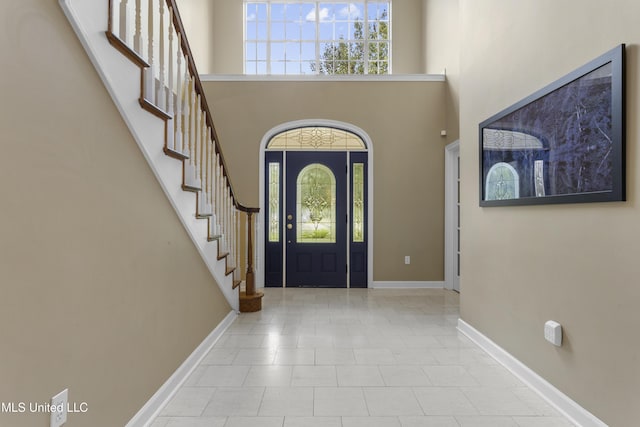 12880 Coles Cv, Gulfport, MS 39503 - entrance foyer featuring a towering ceiling, stairs, and baseboards