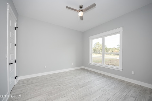 spare room with light hardwood / wood-style floors and ceiling fan