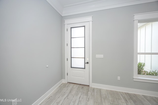 interior space featuring crown molding and light wood-type flooring