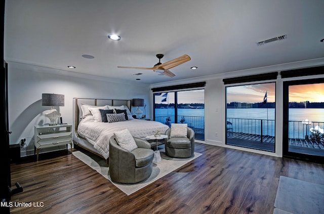 bedroom featuring ceiling fan, access to outside, ornamental molding, dark wood-type flooring, and a water view