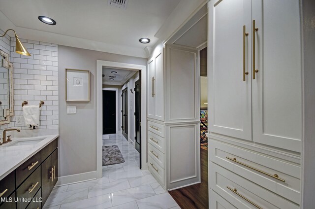 bathroom with vanity and hardwood / wood-style flooring