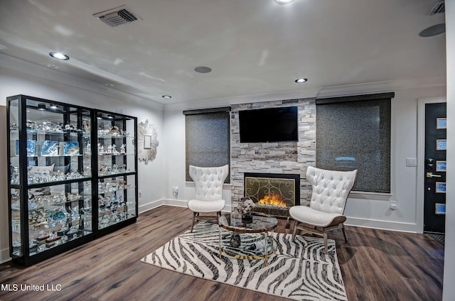 sitting room featuring hardwood / wood-style floors and a fireplace