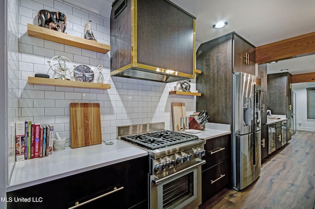 kitchen with stainless steel appliances, tasteful backsplash, and dark hardwood / wood-style flooring