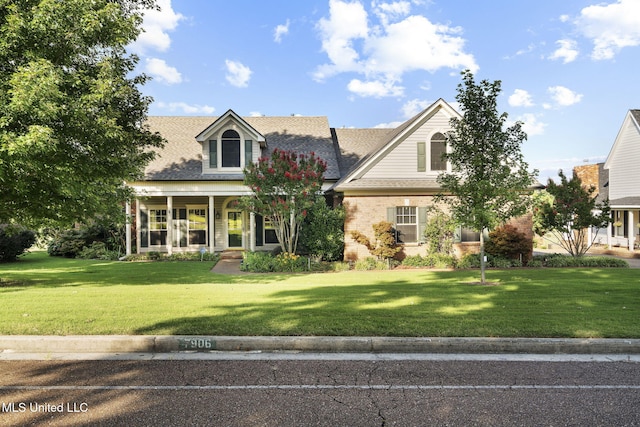 7906 Kirkwood Cv, Olive Branch, MS 38654 - cape cod-style house featuring a front lawn
