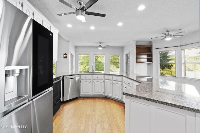 7906 Kirkwood Cv, Olive Branch, MS 38654 - kitchen featuring stainless steel appliances, ceiling fan, light wood-style flooring, recessed lighting, and a textured ceiling
