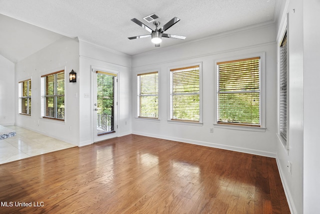 7906 Kirkwood Cv, Olive Branch, MS 38654 - spare room featuring ceiling fan, wood finished floors, a textured ceiling, and ornamental molding