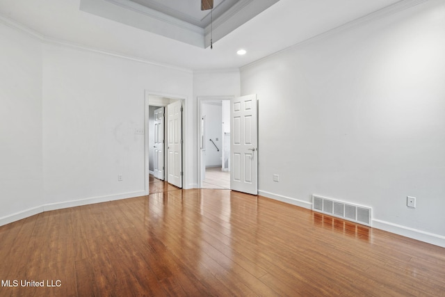 7906 Kirkwood Cv, Olive Branch, MS 38654 - spare room featuring crown molding, wood finished floors, a tray ceiling, recessed lighting, and ceiling fan