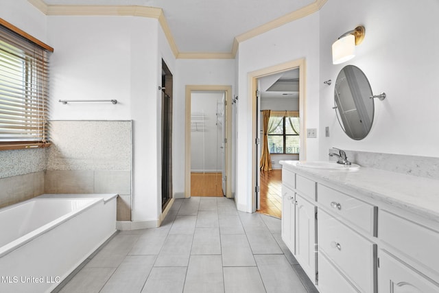 7906 Kirkwood Cv, Olive Branch, MS 38654 - full bath with vanity, a bath, tile patterned flooring, a shower stall, and ornamental molding