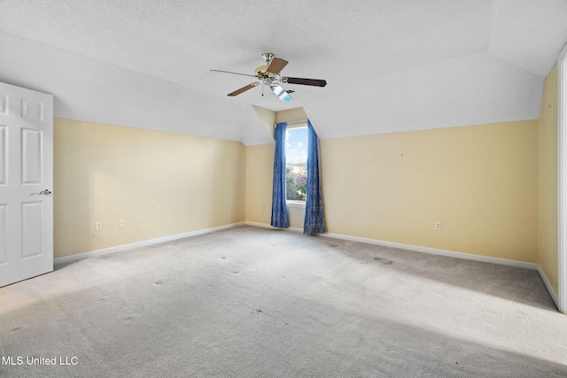7906 Kirkwood Cv, Olive Branch, MS 38654 - additional living space with lofted ceiling, ceiling fan, carpet flooring, and a textured ceiling