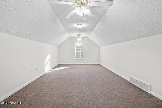 7906 Kirkwood Cv, Olive Branch, MS 38654 - bonus room featuring a textured ceiling, a ceiling fan, carpet flooring, and vaulted ceiling