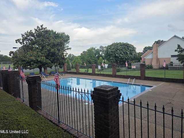7906 Kirkwood Cv, Olive Branch, MS 38654 - community pool featuring a patio area