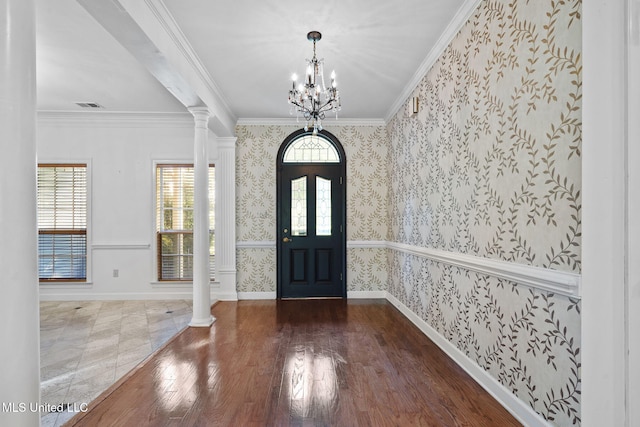 7906 Kirkwood Cv, Olive Branch, MS 38654 - entryway with wallpapered walls, a chandelier, decorative columns, plenty of natural light, and crown molding
