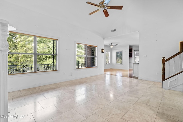7906 Kirkwood Cv, Olive Branch, MS 38654 - unfurnished room featuring ceiling fan, light tile patterned floors, stairs, and high vaulted ceiling