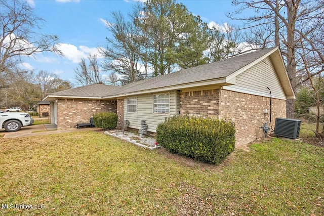 view of front of home with a front lawn and central air condition unit