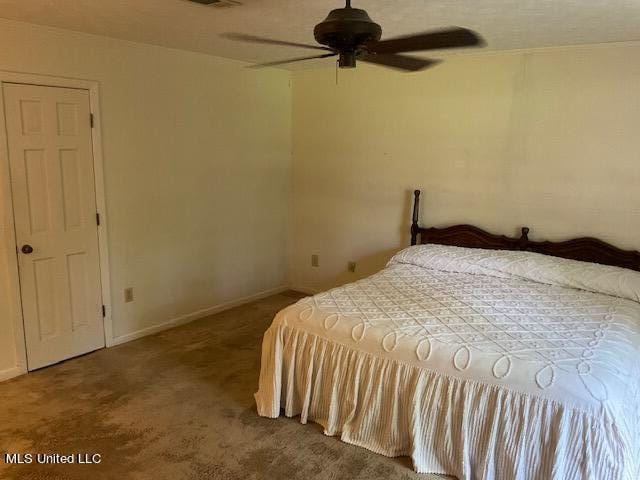 carpeted bedroom with ceiling fan