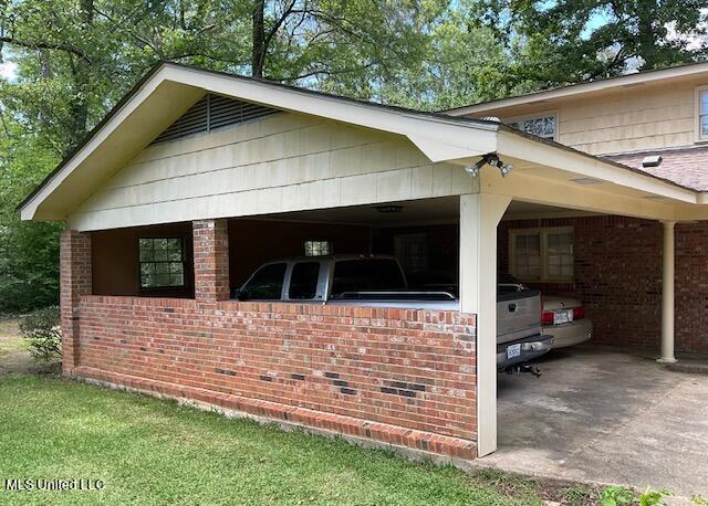 view of home's exterior featuring a carport