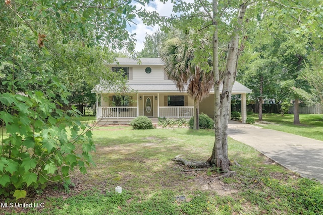 6910 Apuwai Pl, Diamondhead, MS 39525 - view of front facade featuring concrete driveway, covered porch, and an attached carport