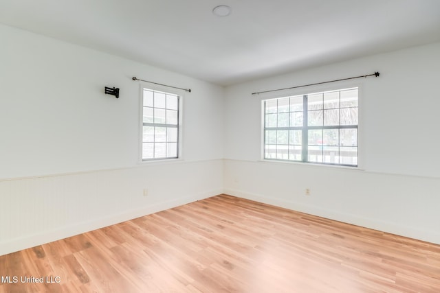6910 Apuwai Pl, Diamondhead, MS 39525 - spare room with wood finished floors and a wainscoted wall