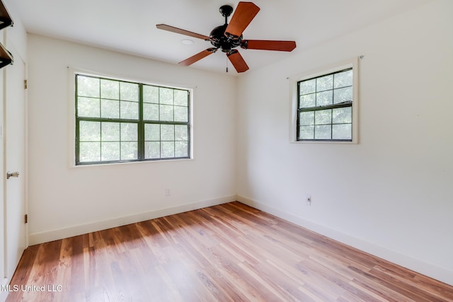 6910 Apuwai Pl, Diamondhead, MS 39525 - empty room featuring plenty of natural light, light wood-style flooring, and ceiling fan