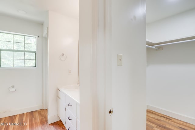 6910 Apuwai Pl, Diamondhead, MS 39525 - bathroom featuring vanity and wood finished floors