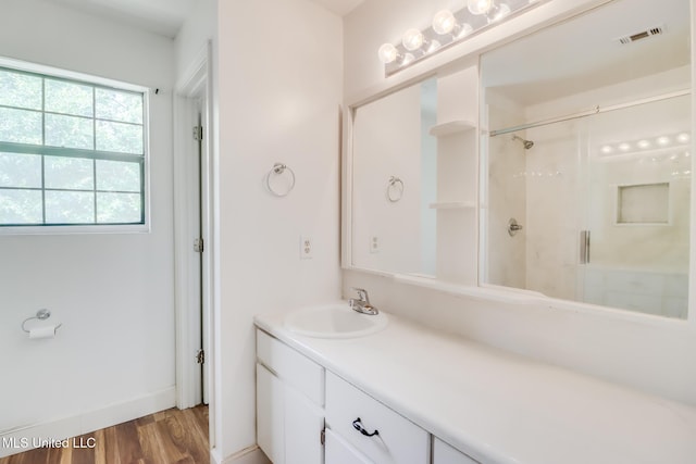 6910 Apuwai Pl, Diamondhead, MS 39525 - full bathroom with a stall shower, vanity, and wood finished floors