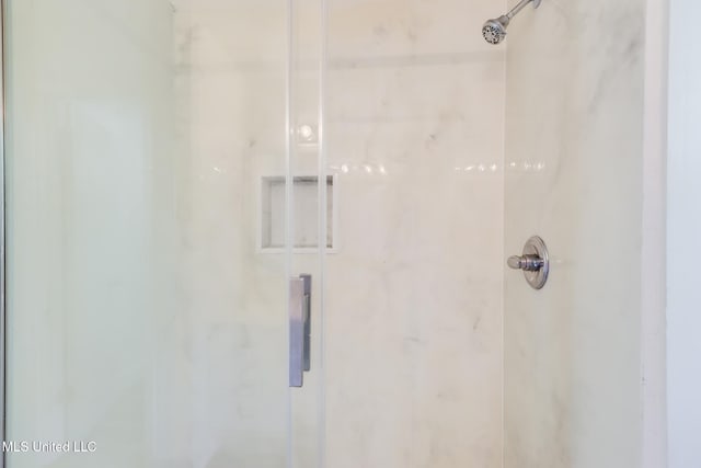 6910 Apuwai Pl, Diamondhead, MS 39525 - bathroom featuring a marble finish shower