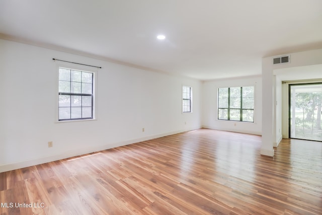6910 Apuwai Pl, Diamondhead, MS 39525 - empty room featuring light wood-style flooring and baseboards