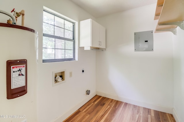 6910 Apuwai Pl, Diamondhead, MS 39525 - laundry area featuring electric panel, cabinet space, light wood-style floors, washer hookup, and water heater