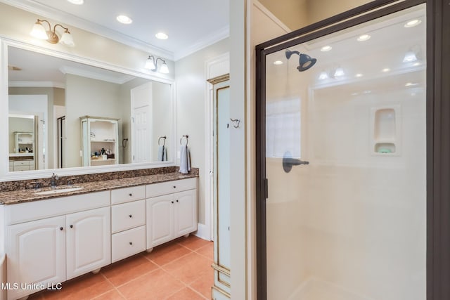 bathroom with crown molding, a shower stall, tile patterned flooring, vanity, and recessed lighting