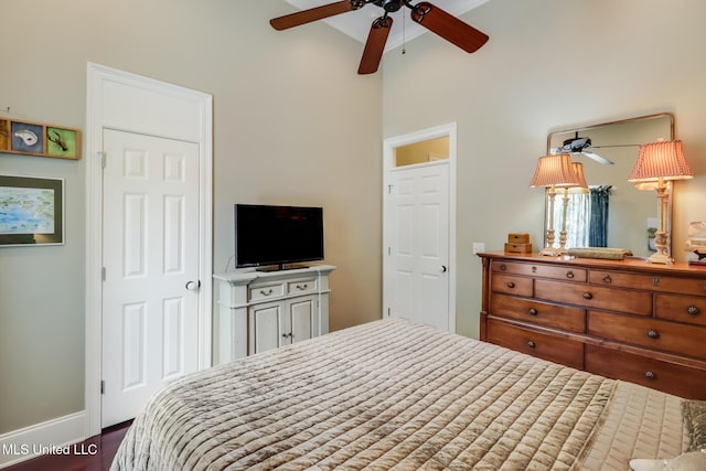 bedroom with baseboards and wood finished floors