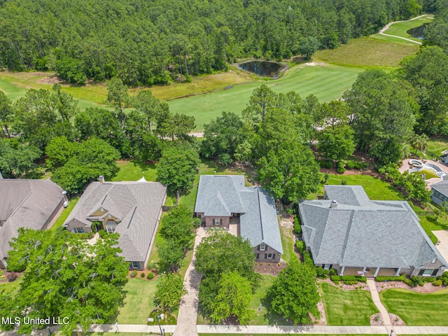 aerial perspective of suburban area with a large body of water and a local golf course