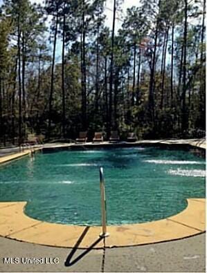 outdoor pool with a patio