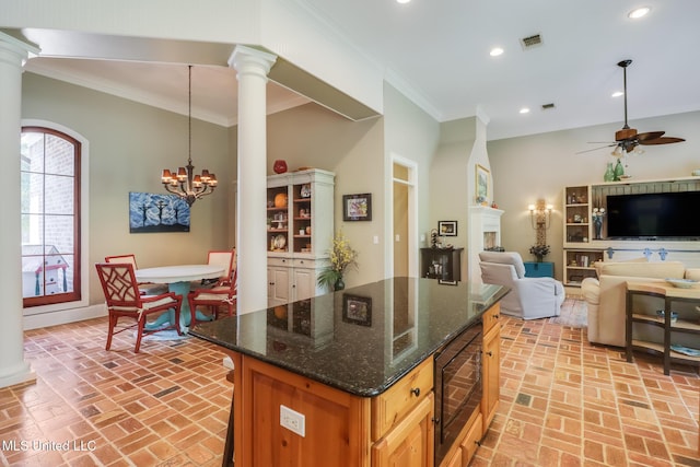kitchen with black microwave, brick flooring, ornate columns, a ceiling fan, and recessed lighting