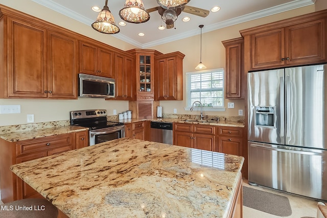 kitchen featuring appliances with stainless steel finishes, a sink, and brown cabinets