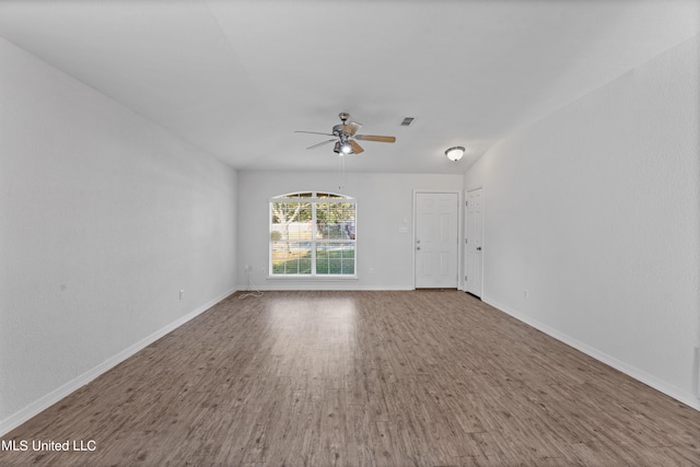 spare room featuring hardwood / wood-style floors and ceiling fan