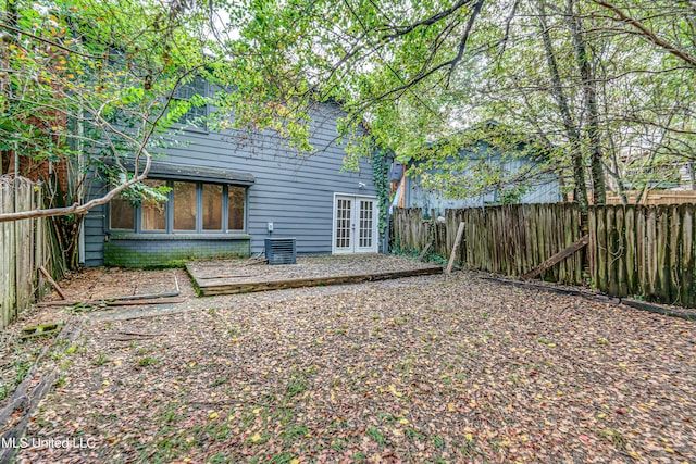 back of property featuring french doors