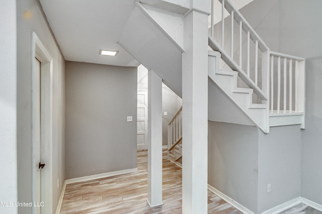 stairway featuring hardwood / wood-style floors