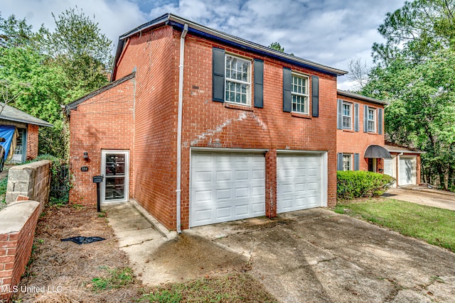 view of side of home with a garage