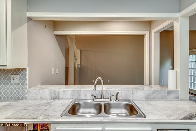 details featuring backsplash and sink