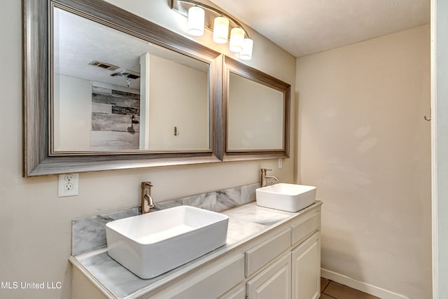 bathroom featuring vanity and tile patterned flooring